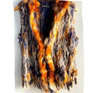Rabbit fur vest in purple, cream and orange vibrating colors for  cold weather .